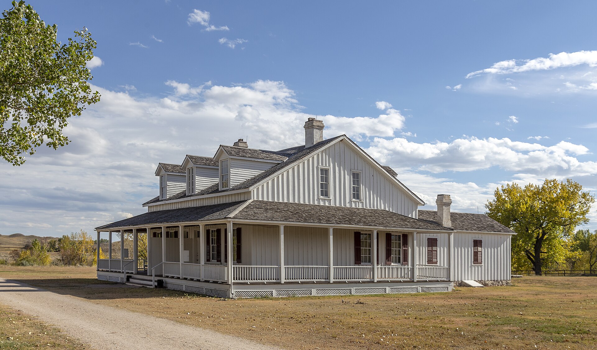 Fort Laramie National Historic Site in Wyoming, showing the restored fort buildings and parade ground with the surrounding high plains landscape.
