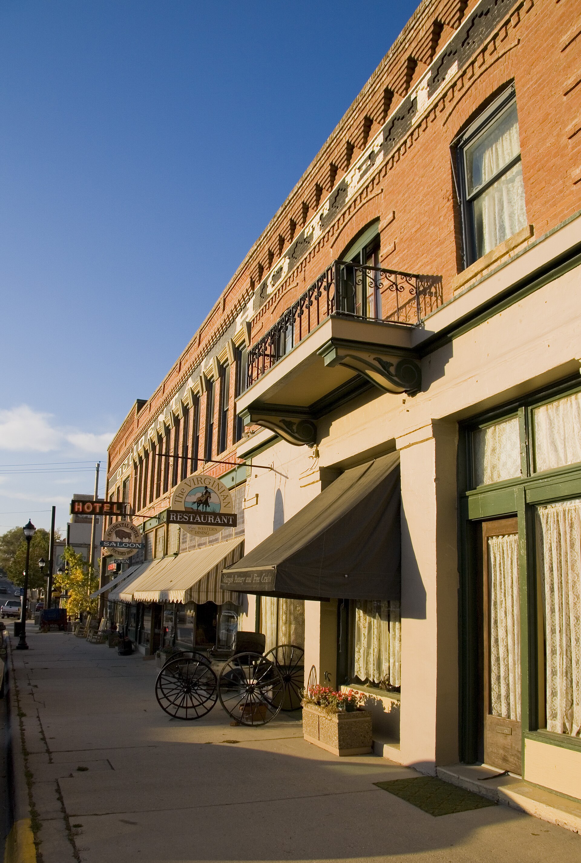 Exterior of the historic Occidental Hotel in Buffalo, Wyoming, a two-story Victorian-era building on the main street.