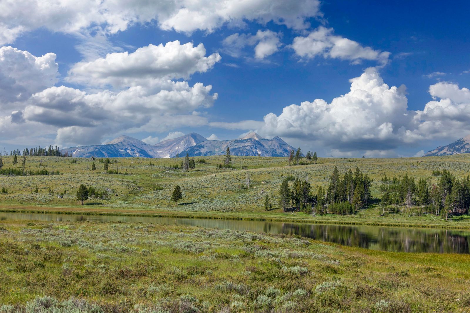 Wyoming highway with mountain country opening up in the distance.