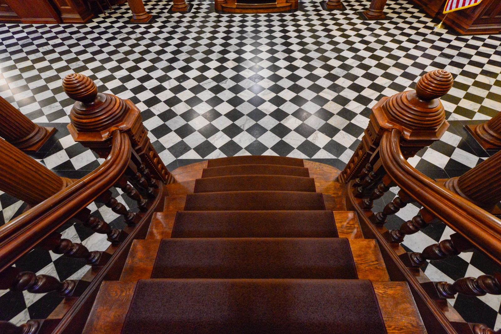 Interior staircase of the Wyoming State Capitol in Cheyenne, with black-and-white checkered floor.