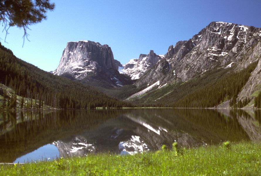 The Green River Lakes in the Bridger-Teton National Forest near Pinedale, Wyoming, with Squaretop Mountain reflected in the still water and the Wind River Range peaks above.