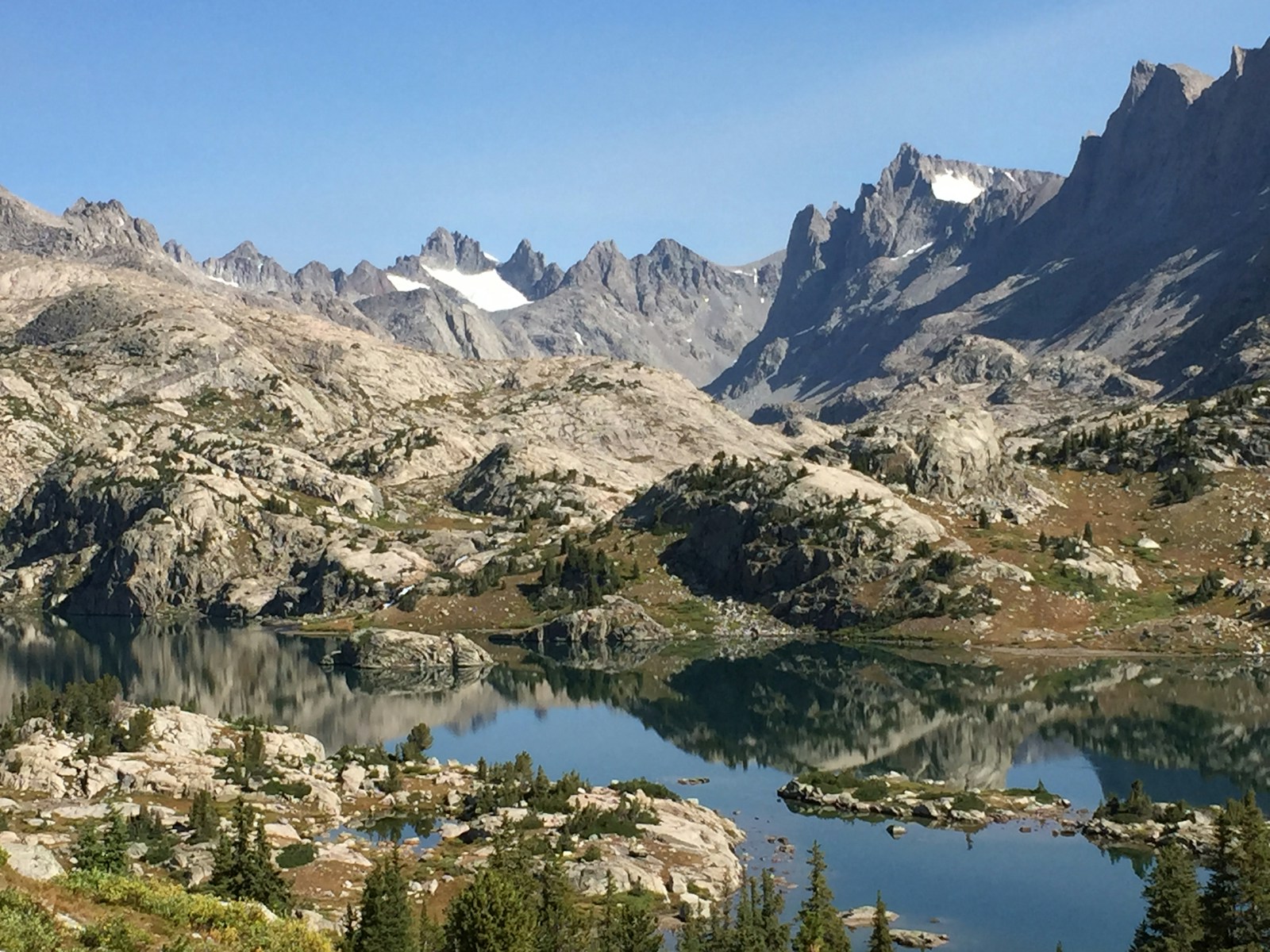 Wind River Range alpine landscape, granite peaks and high meadows.