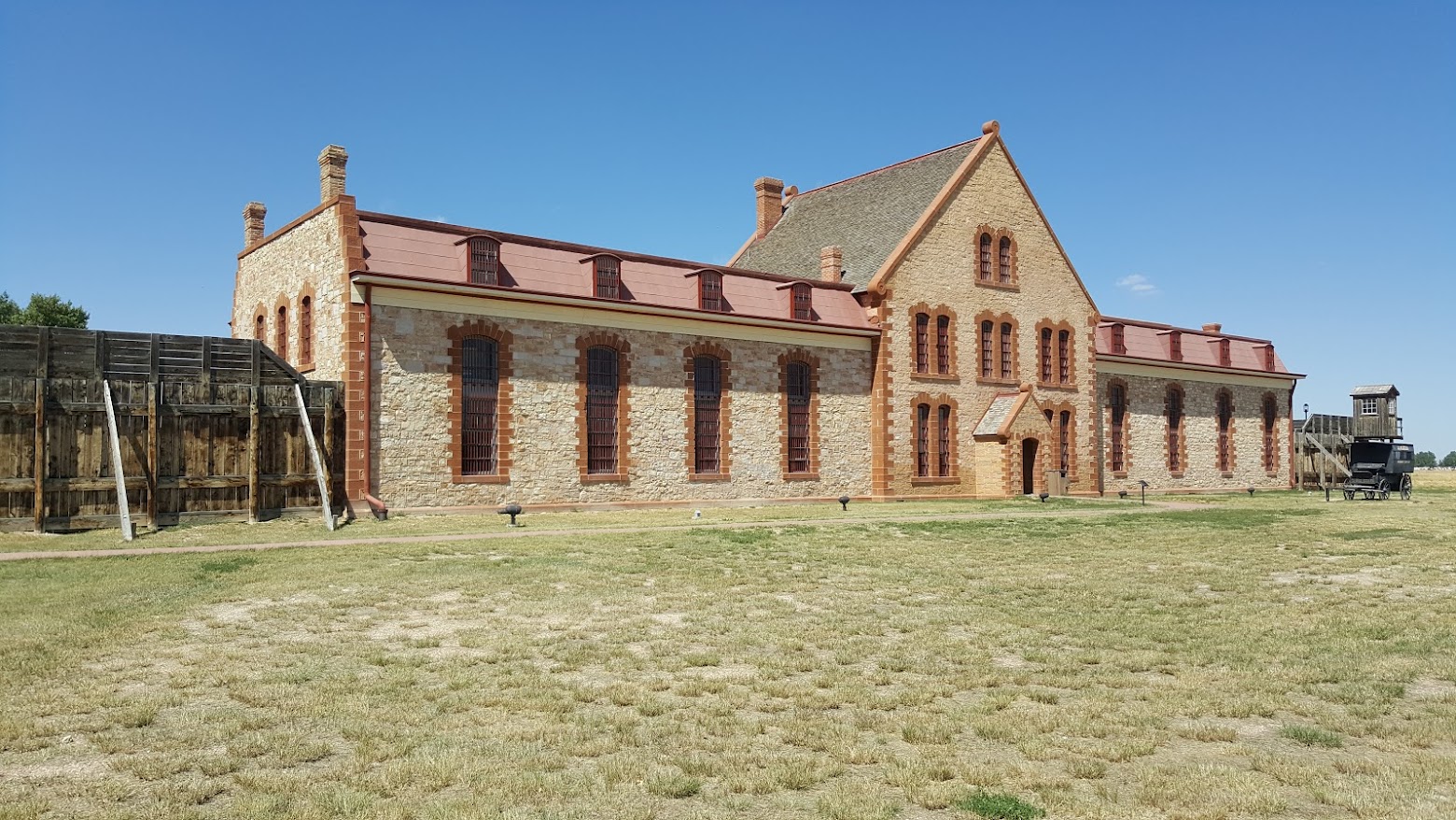 The Wyoming Territorial Prison State Historic Site in Laramie, Wyoming, with the original 1872 stone cellblock and prison farm buildings preserved on site.
